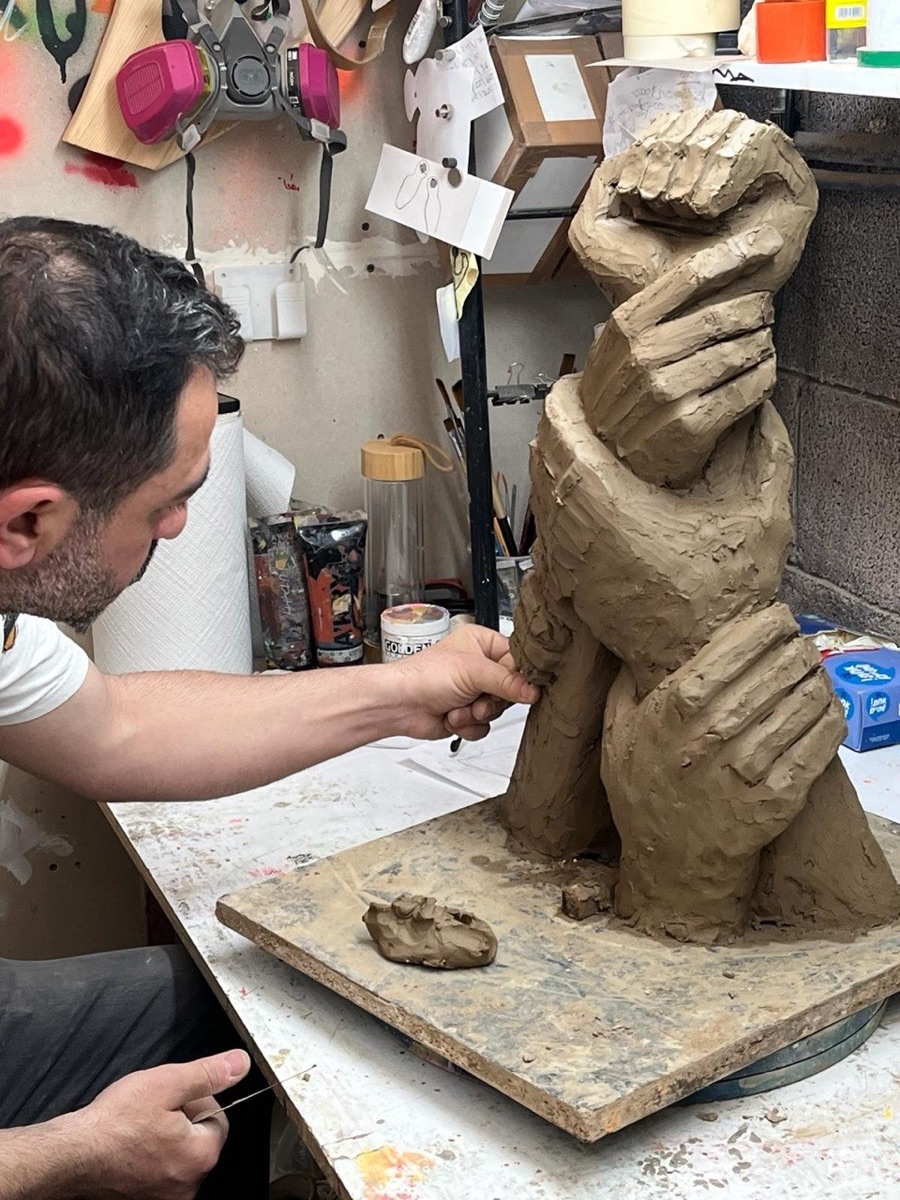 Sculptor Tariel Damchinsky shaping the clay model of The Great Shofar in his Jerusalem studio